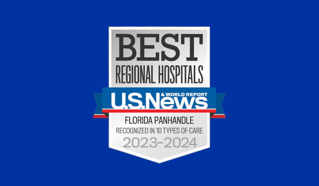 A badge with text on a blue background. The badge reads "BEST REGIONAL HOSPITALS," and underneath, "U.S. News & World Report." Below that, it reads "Florida Panhandle," "Recognized in 10 Types of Care," for the years "2023-2024.